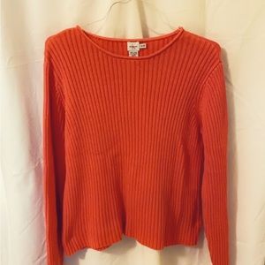 Calvin Klein Jeans brand sweatshirt in a dark redish orange.